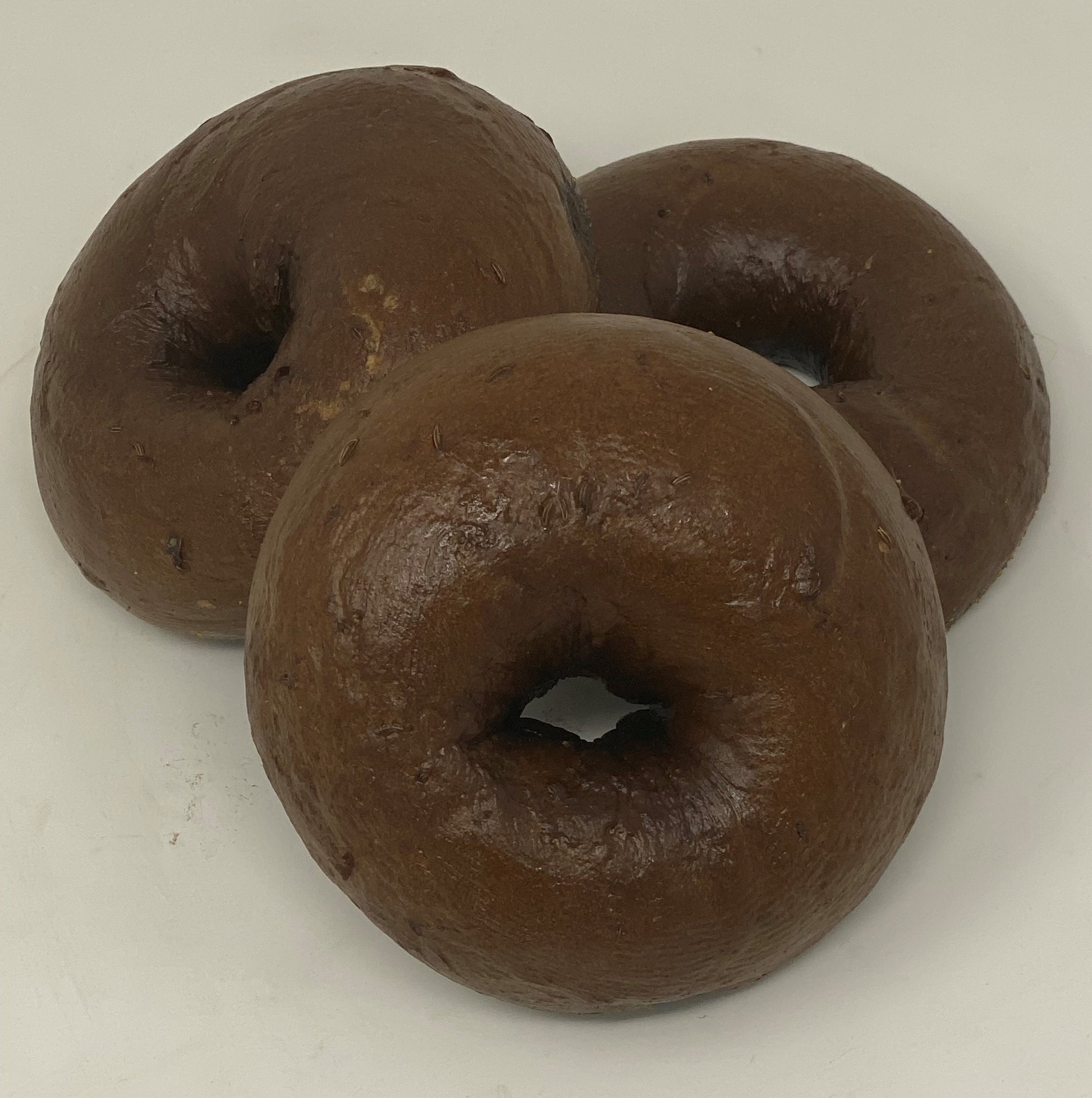 New York Style Pumpernickel bagels. Our bagels are boiled and baked, not steamed. A little tough on the outside and soft on the inside.